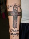 text and cross tattoo